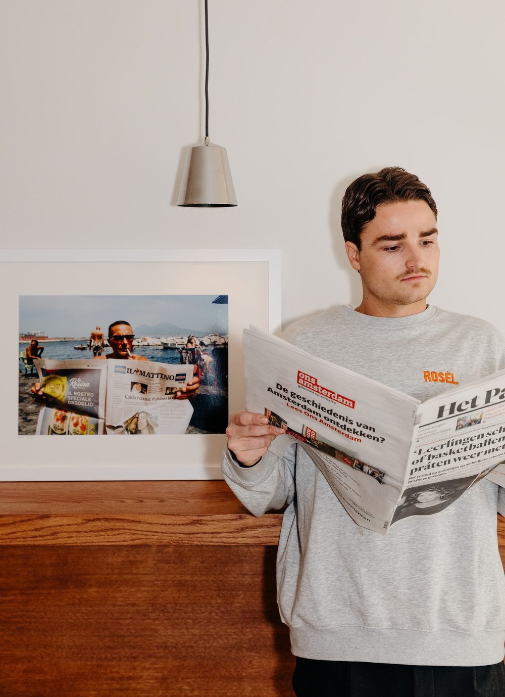 A guest reading the newspaper at Rosèl